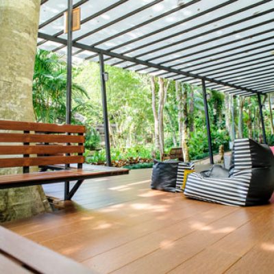 Brown SPC Flooring installed on a deck with bean bags